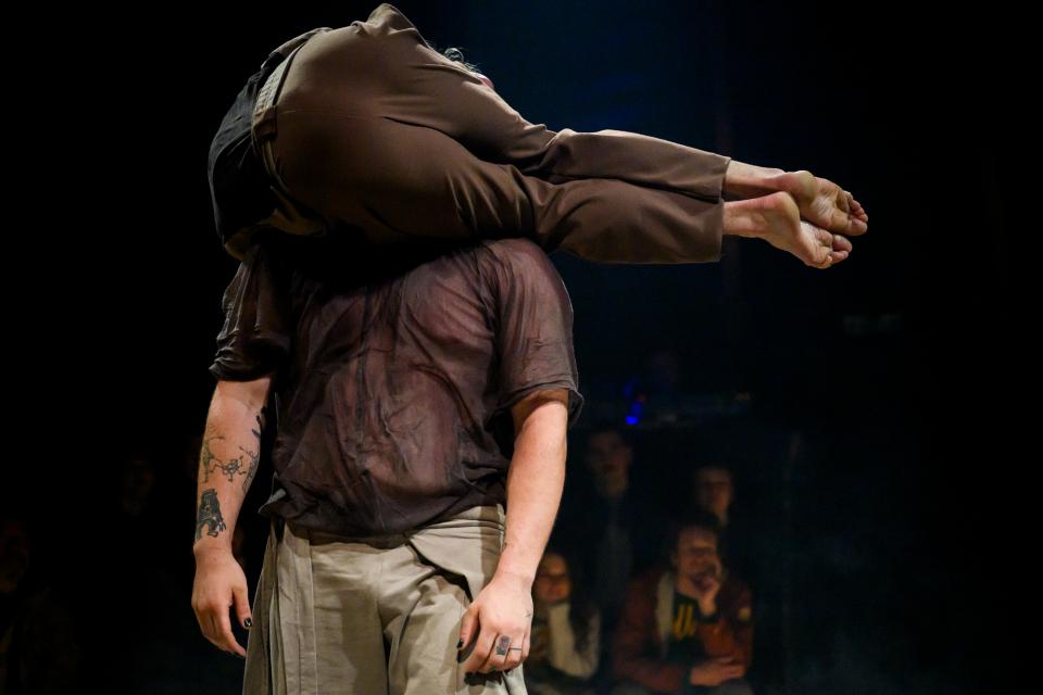 two acrobats on stage