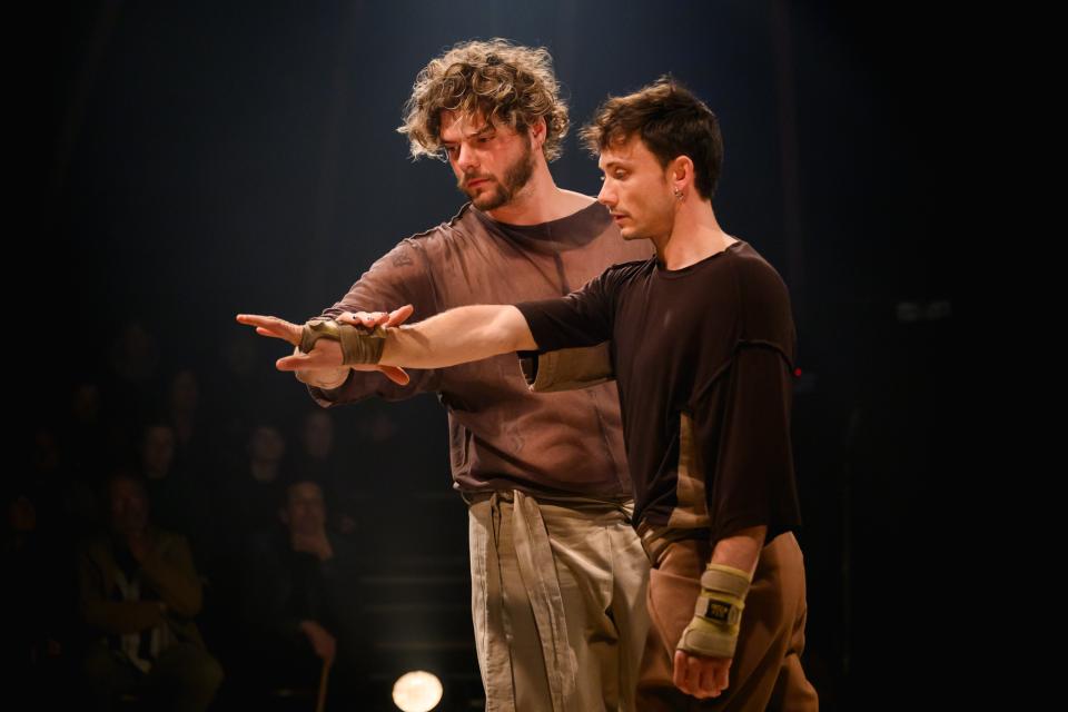 two acrobats on stage